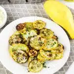 air fried yellow squash on a dish with text overlay