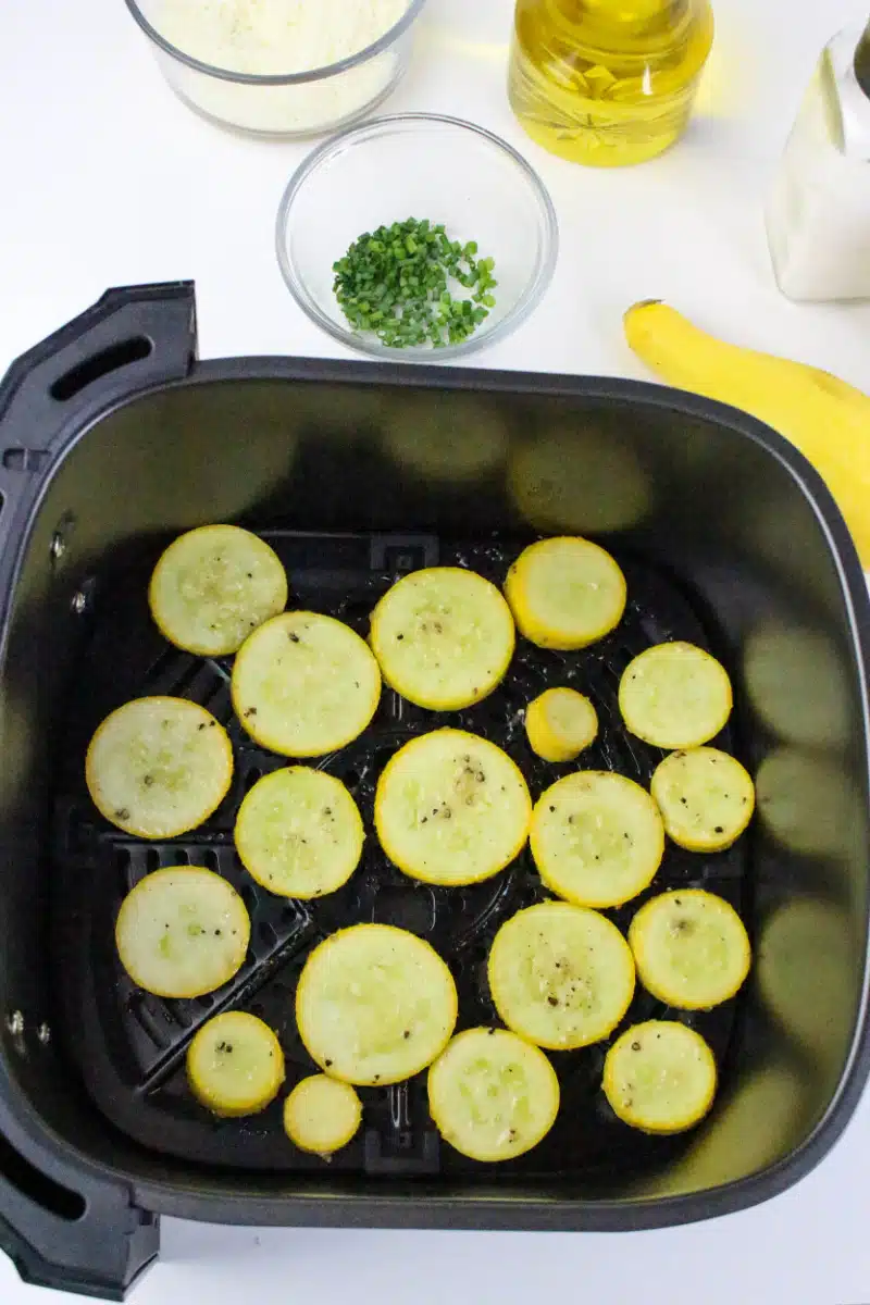 slices of squash in an air fryer