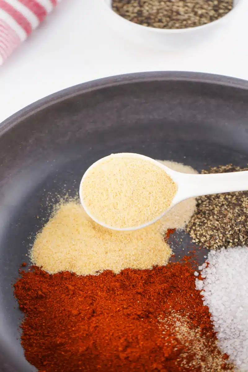 combining ingredients for spice rub in a bowl