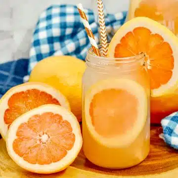 close up of paloma punch in a glass with slice of grapefruit on the side