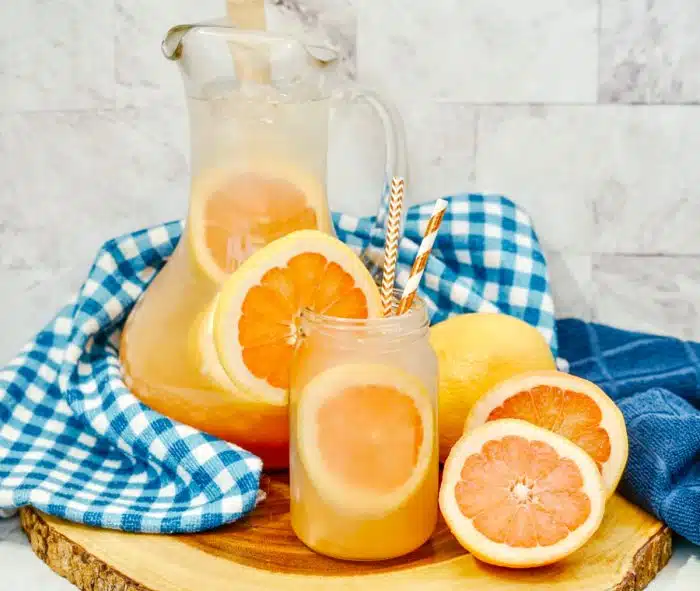 Paloma punch in a glass and a pitcher