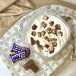 overhead of snickers ice cream in freezer-safe container