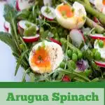 jammy eggs over spinach and asparagus salad with text overlay