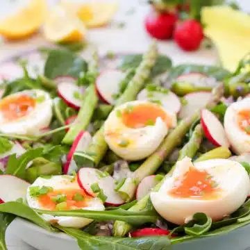 spinach salad with arugula and soft boiled eggs