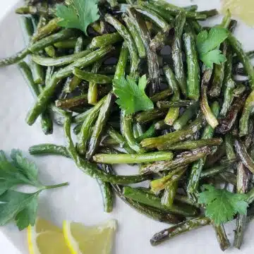 sauteed garlic scapes on a platter