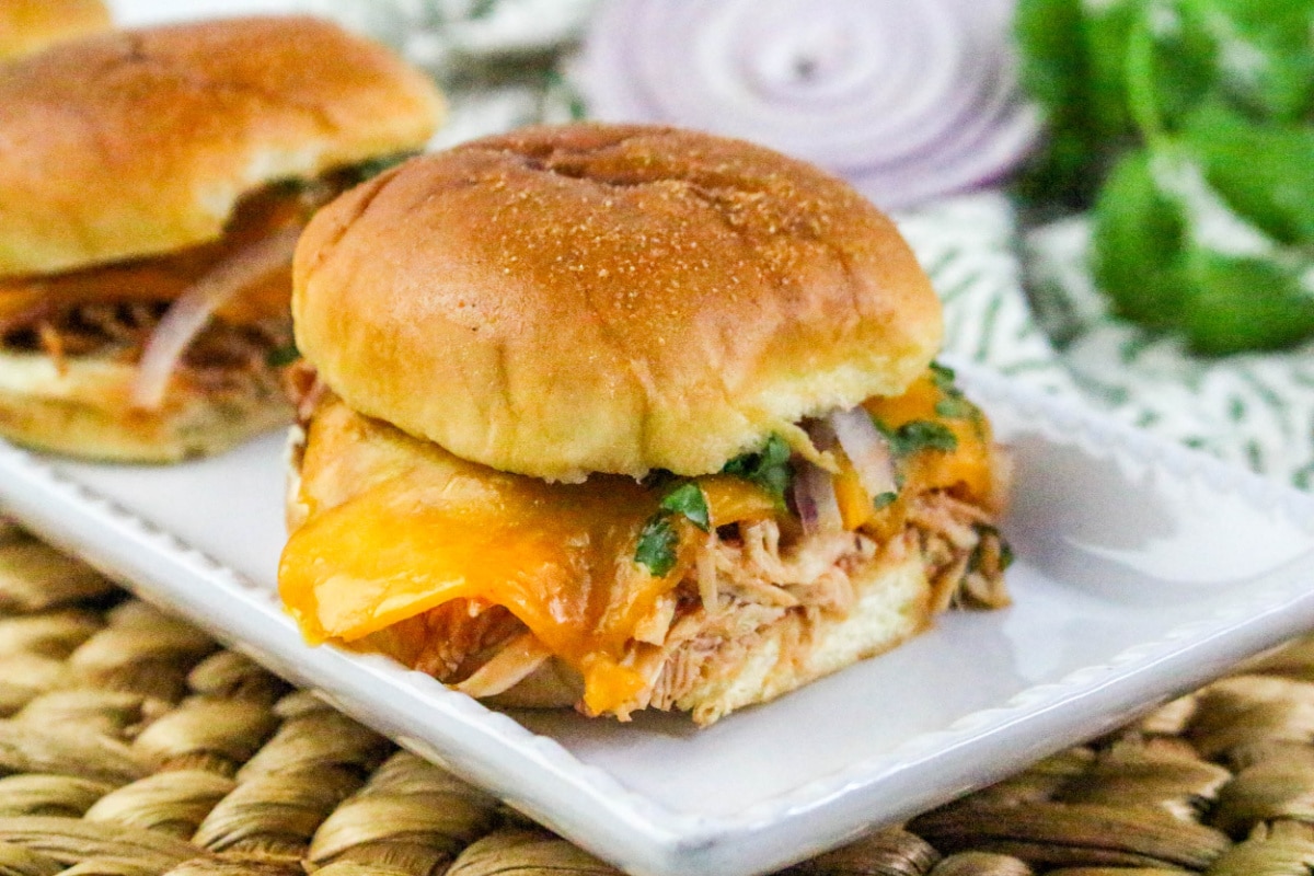 rotisserie chicken slider on a white plate