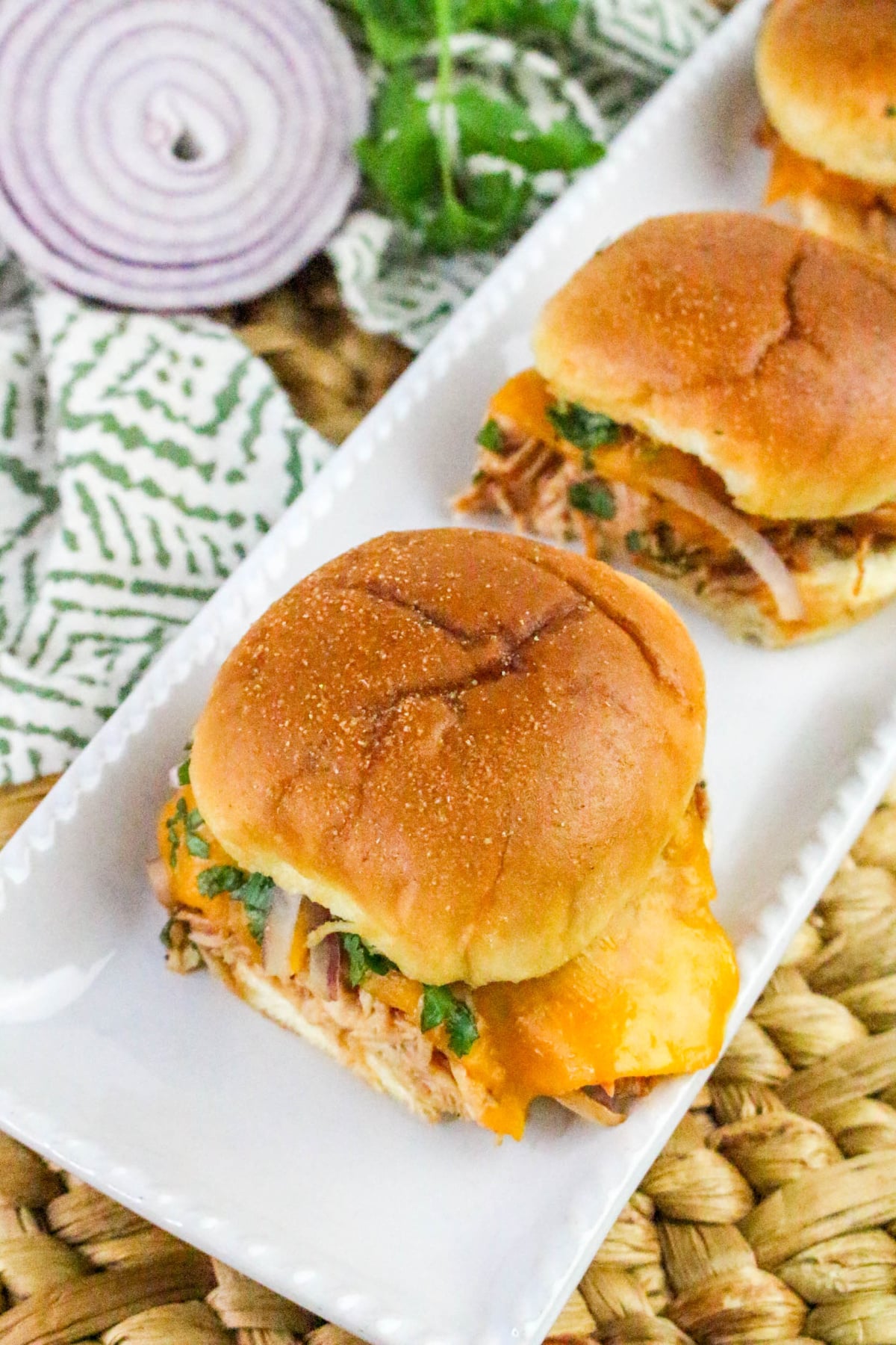 chicken sliders on a white dish