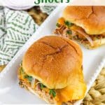 two chicken sliders on a white plate with text overlay