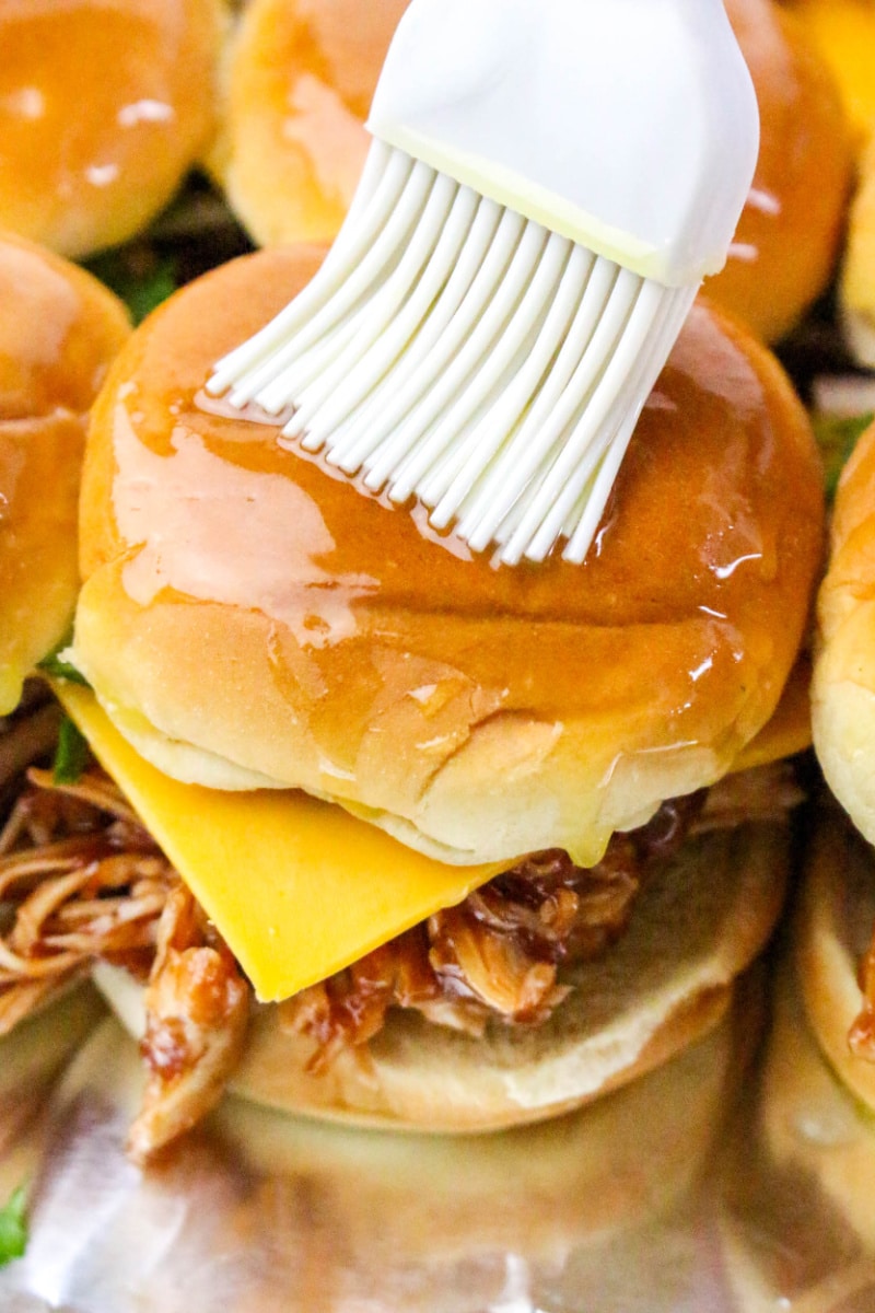 brushing sliders with melted butter