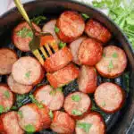 sliced kielbasa on a fork with text overlay