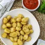 overhead of air fried gnocchi with marinara dipping sauce