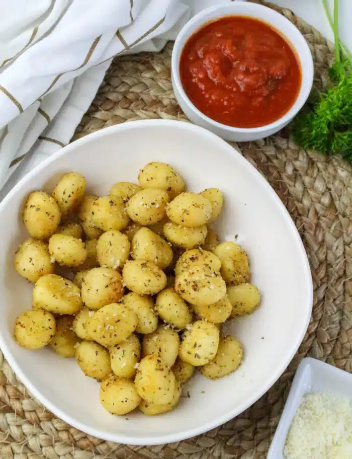 overhead of air fried gnocchi with marinara dipping sauce