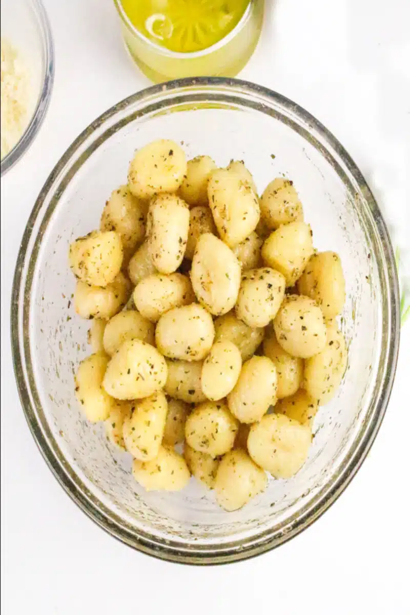 gnocchi tossed with seasonings in a clear bowl