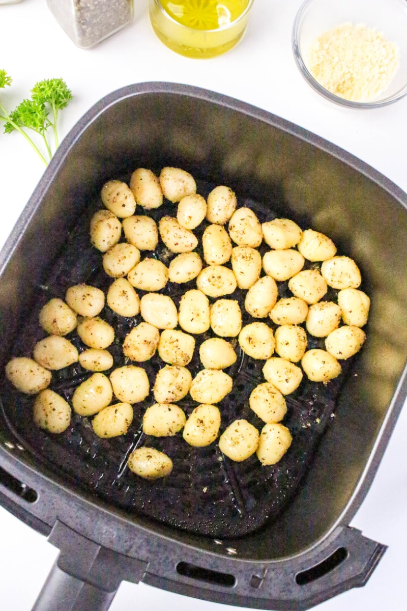 gnocchi in the air fryer basket before cooking