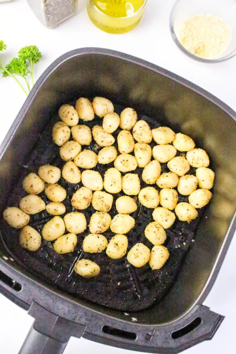 gnocchi in the air fryer basket before cooking