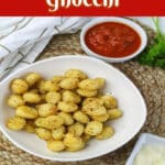 dish filled with crispy air fried gnocchi with text overlay