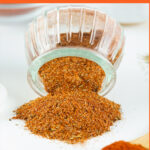 blackened spice blend spilling out of a clear jar with text overlay