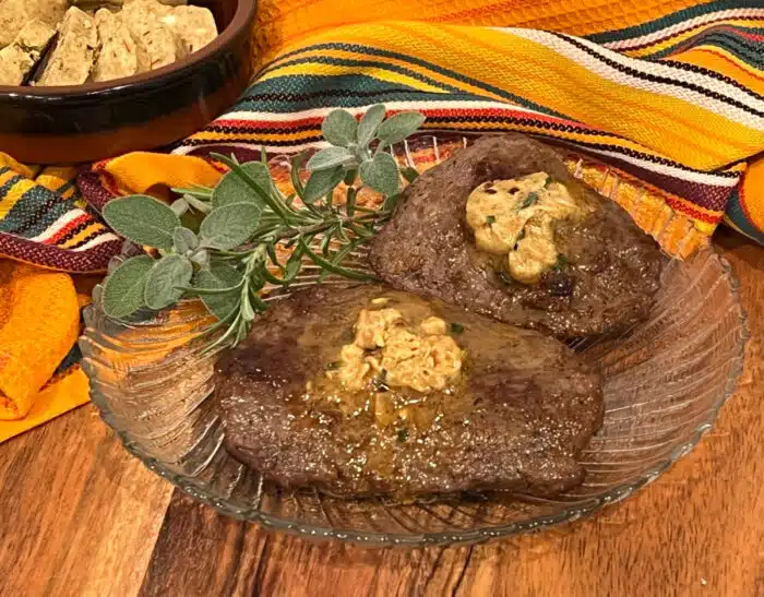 cowboy butter melting on top of steaks