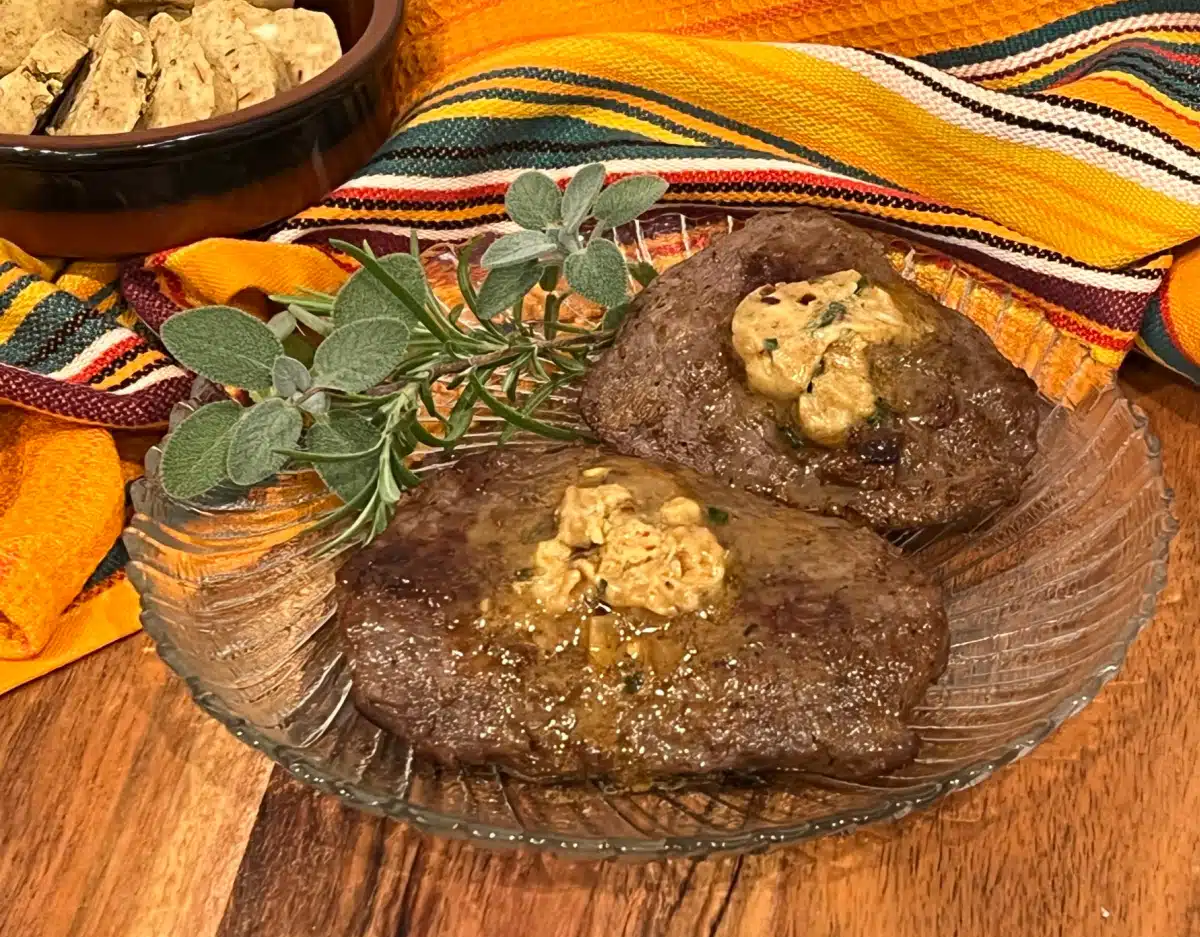 cowboy butter melting on top of steaks