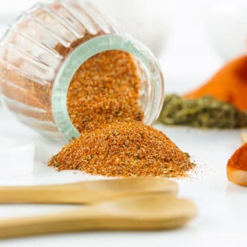 blackened seasoning spilling out of a jar