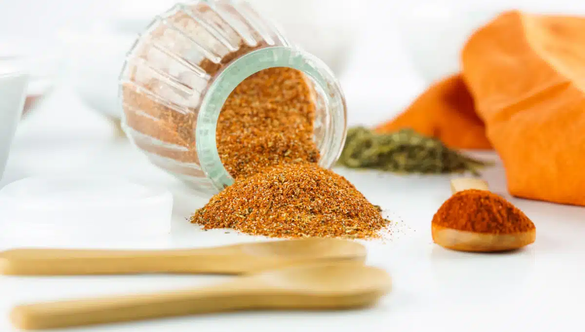 blackened seasoning spilling out of a jar