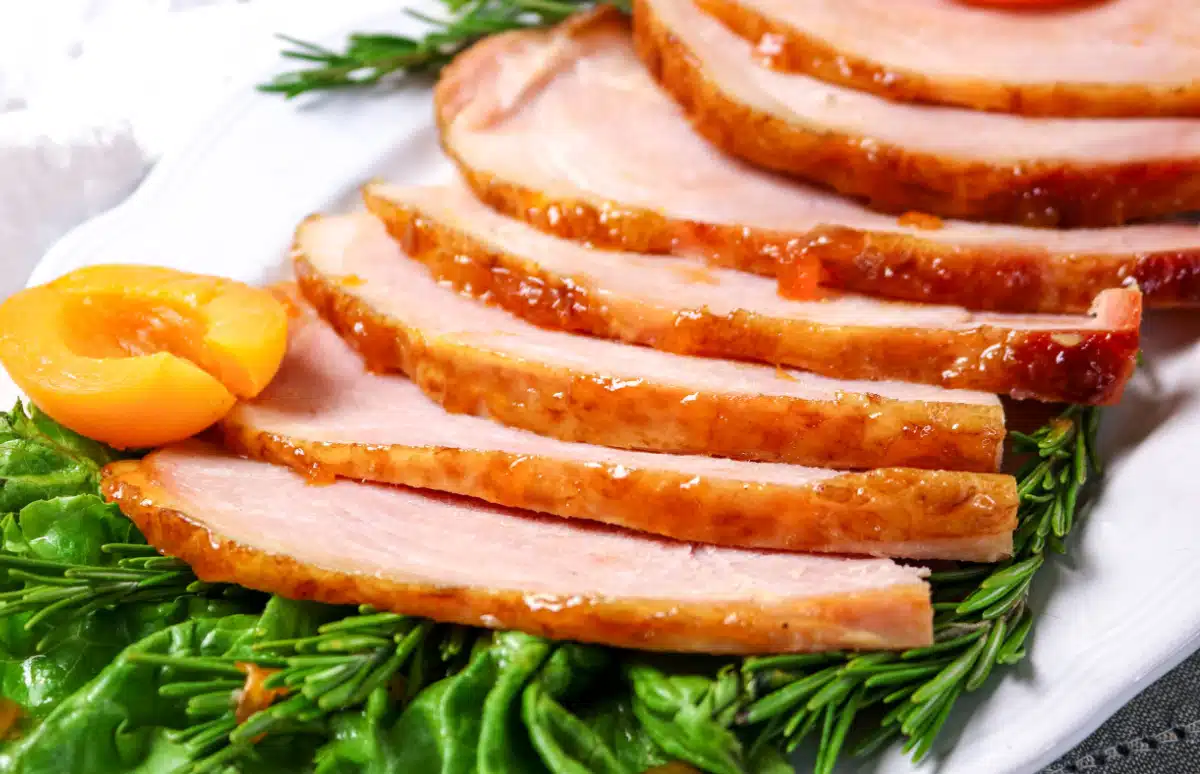 slices of spiral ham with greens