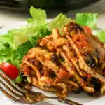 layered taco casserole serving on a plate