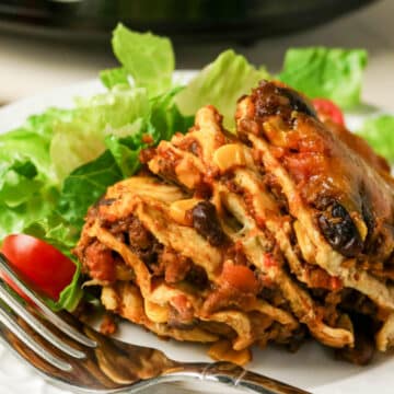 layered taco casserole serving on a plate