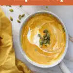 bowl of pumpkin soup with text overlay