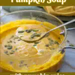 pot of creamy pumpkin soup with spoon and text overlay