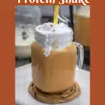 pumpkin protein shake with cold foam n a glass mason jar with handle and text overlay
