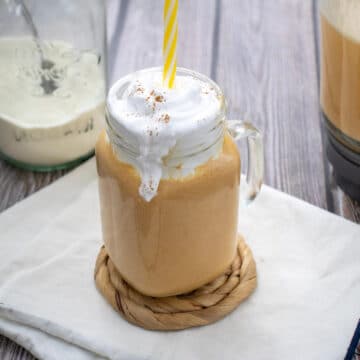 Pumpkin Spice Protein Shake in a mason jar mug with a handle