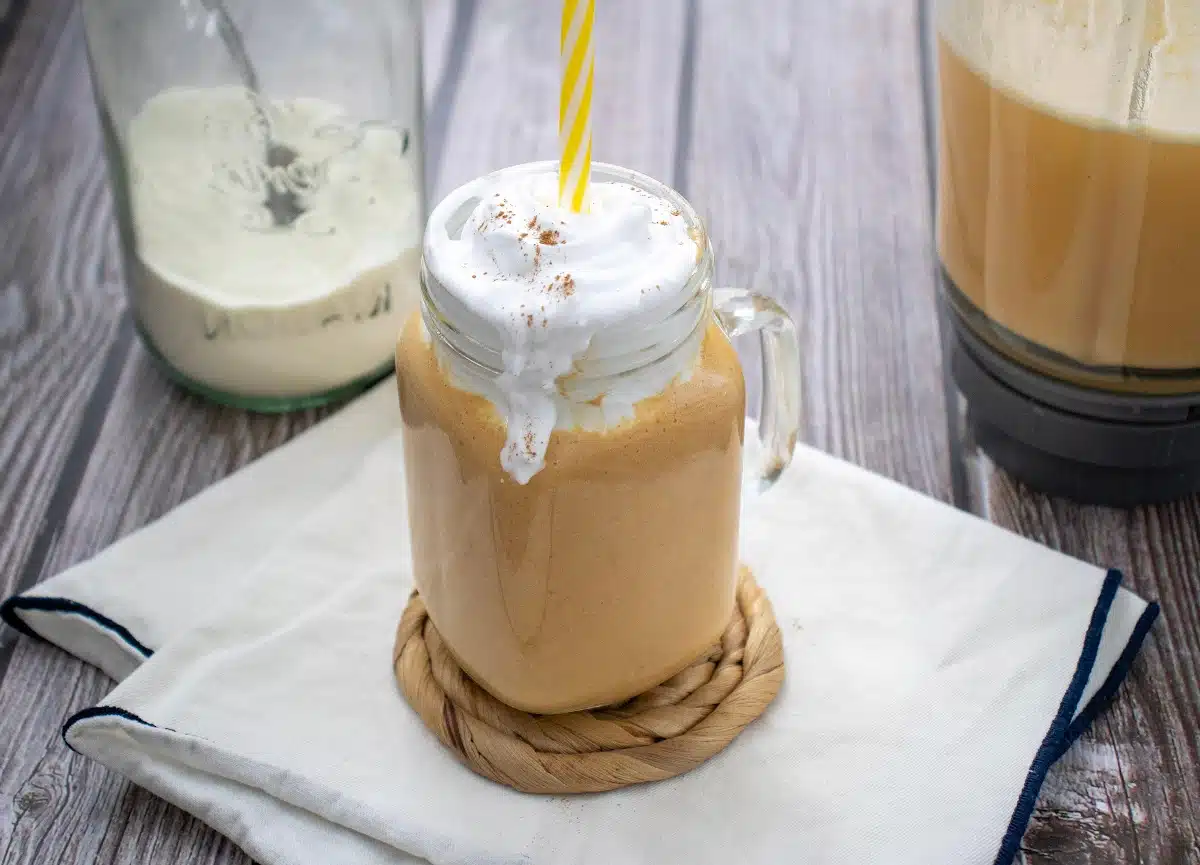Pumpkin Spice Protein Shake in a mason jar mug with a handle