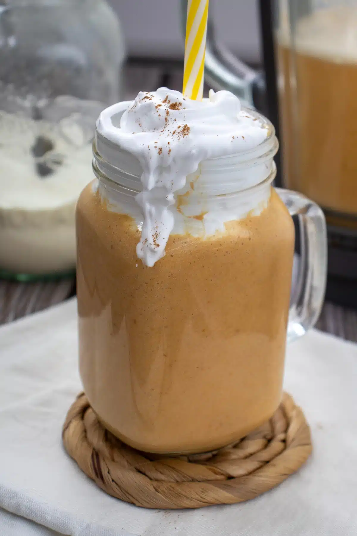 close up of pumpkin pie protein smoothie with cold foam topping