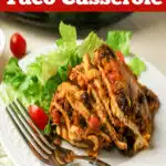 layered taco serving on a plate with text overlay