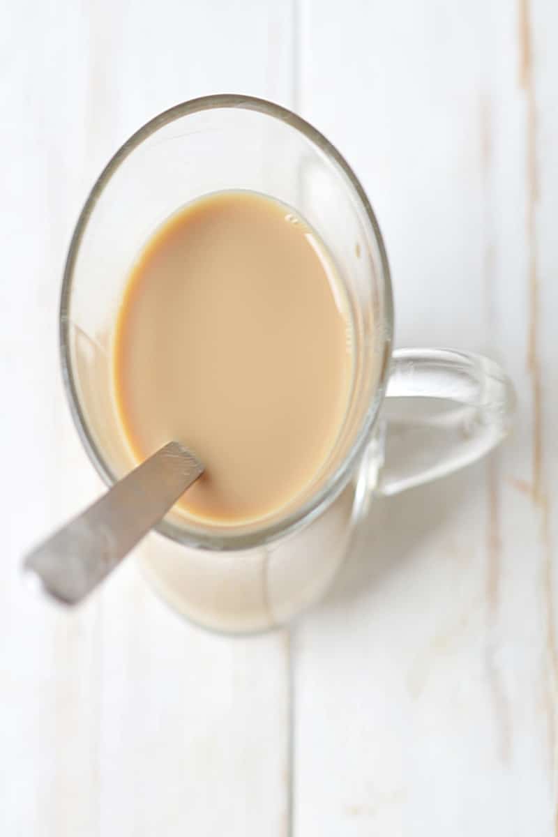 vanilla syrup, milk and espersso in a mug