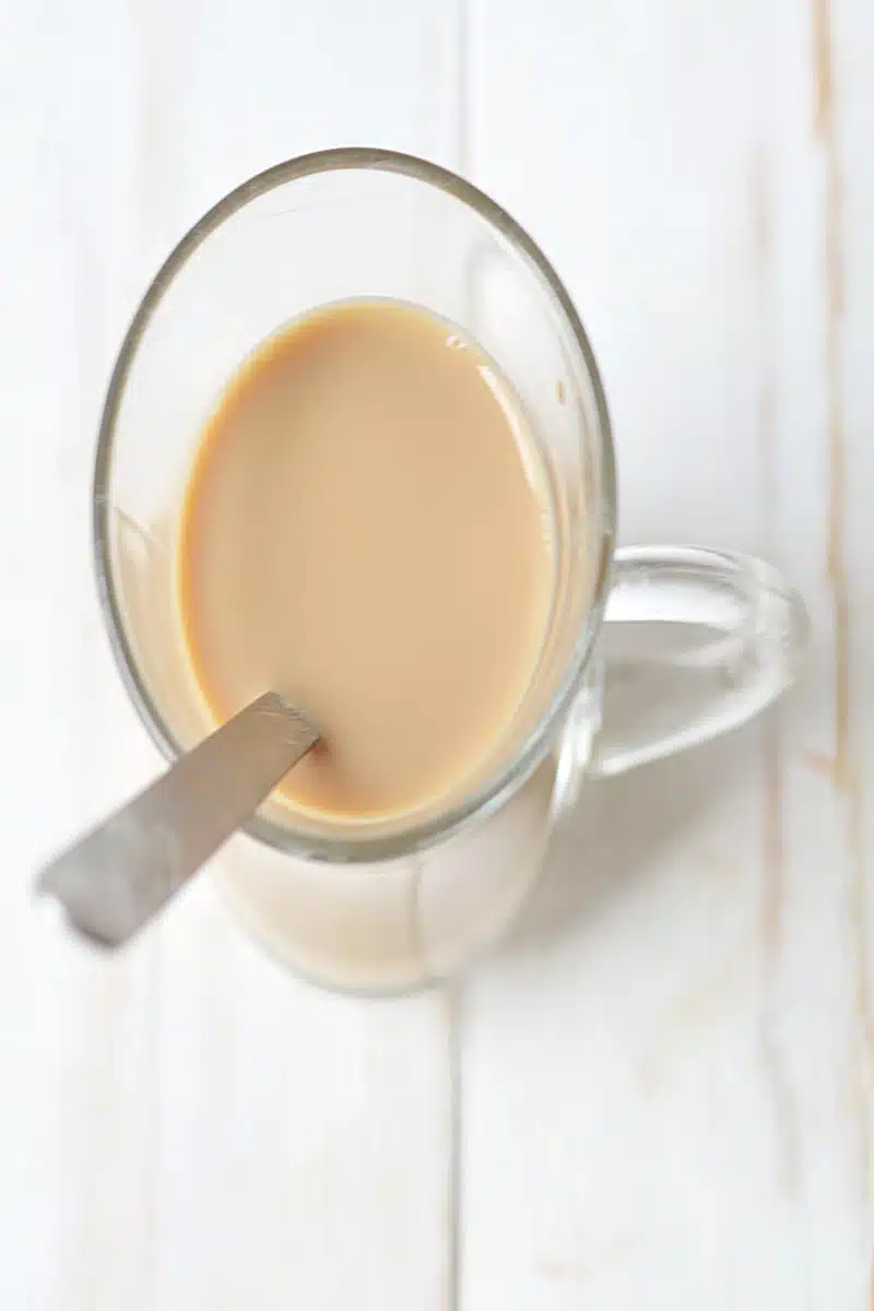 vanilla syrup, milk and espersso in a mug