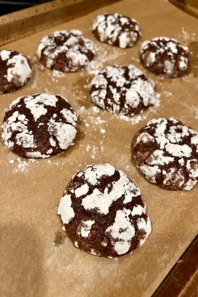baked chocolate crinkle cookies on baking sheet