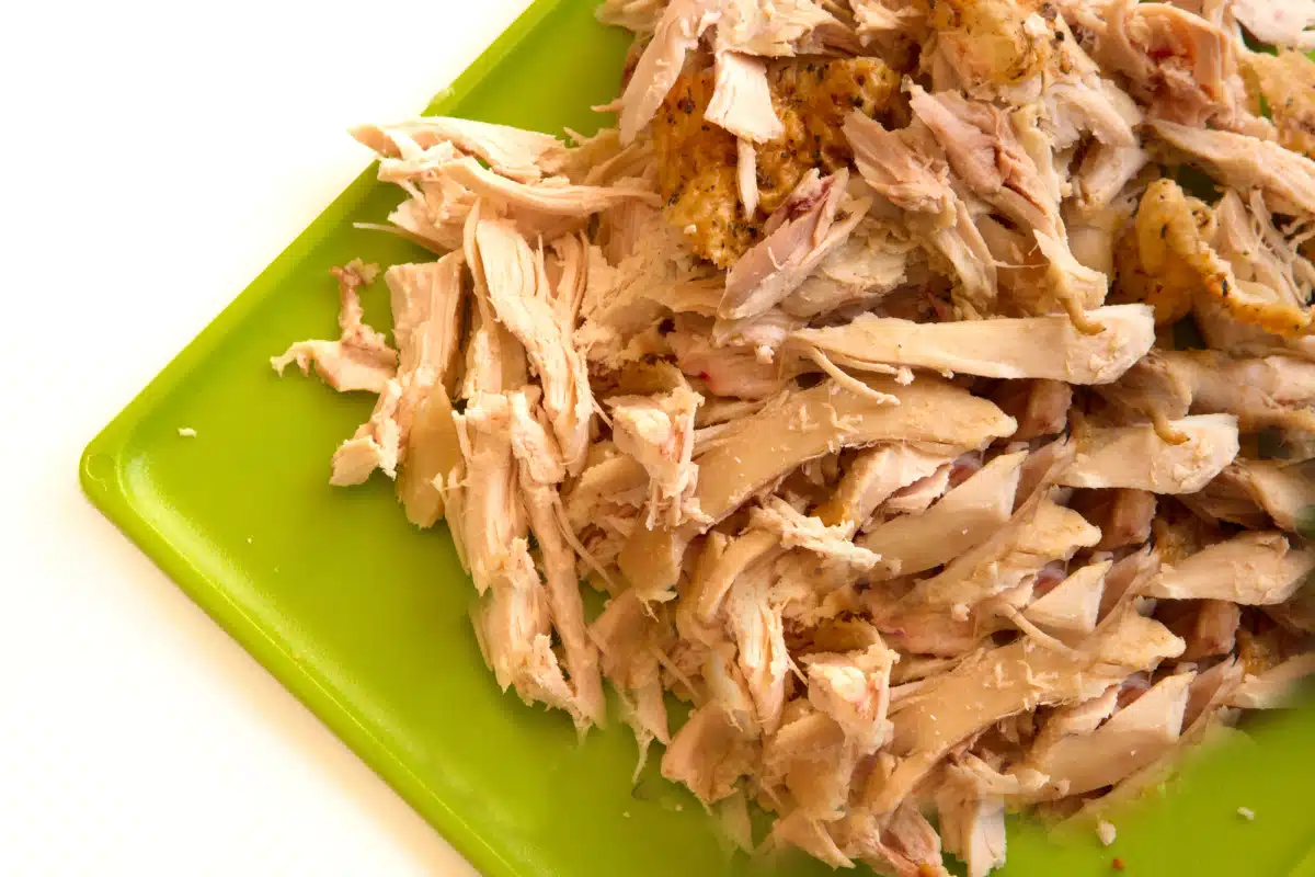 shredded chicken on a green platter