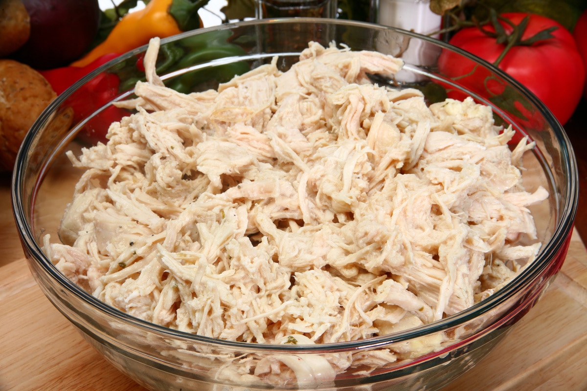 shredded chicken in a glass bowl