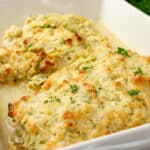 baked chicken and artichokes in a casserole dish