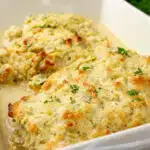 baked chicken and artichokes in a casserole dish
