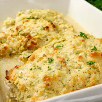 baked chicken and artichokes in a casserole dish
