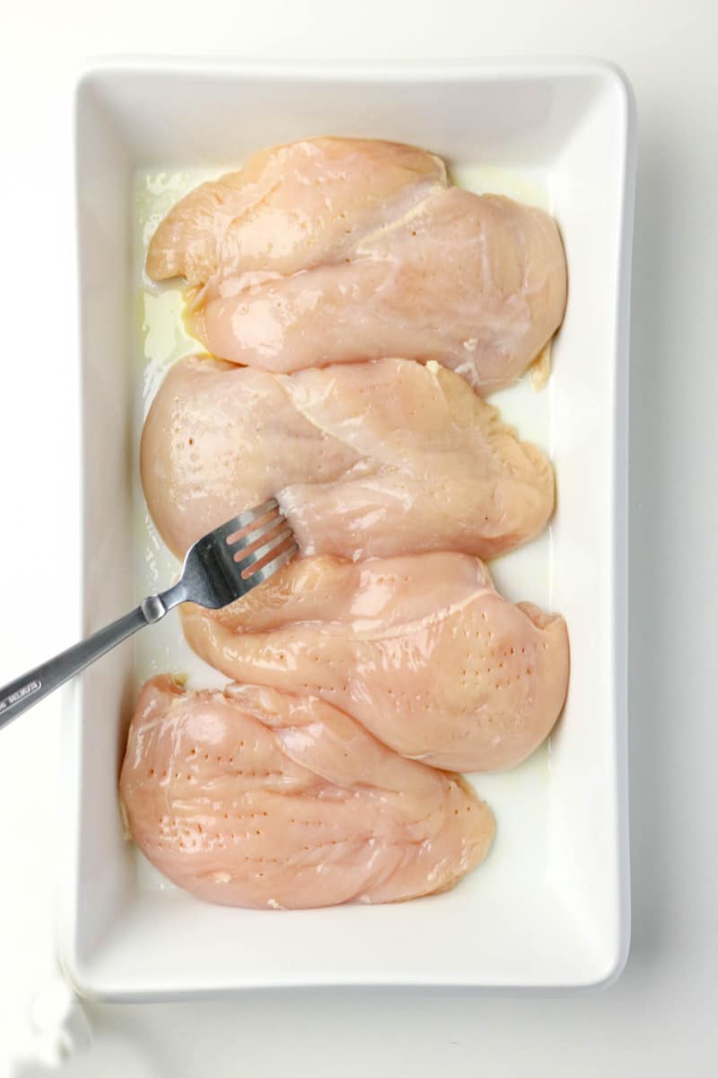 arrange chicken breasts in casserole baking dish
