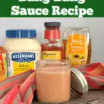 homemade bang bang sauce in a mason jar with ingredients in the background and text overlay