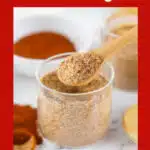 jerk seasoning in a glass jar with a spoon and text overlay