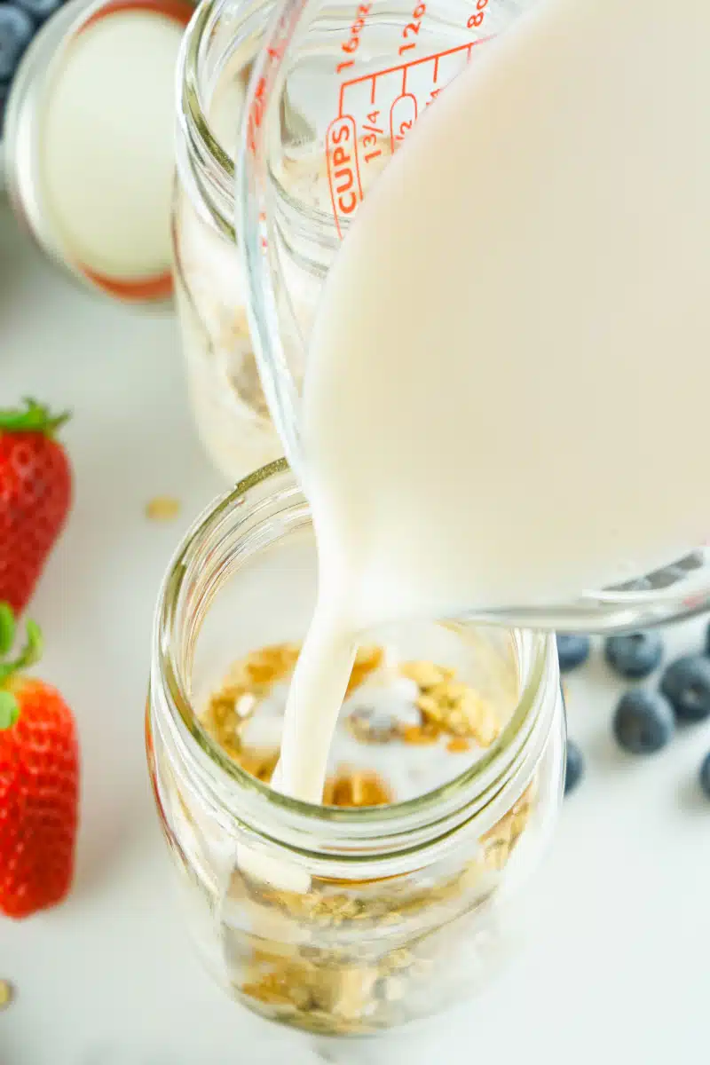 pouring milk over oats