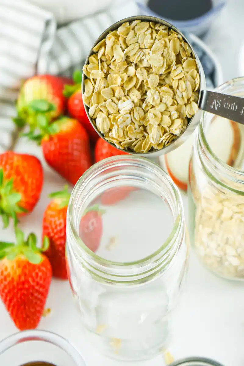 adding oats to mason jar