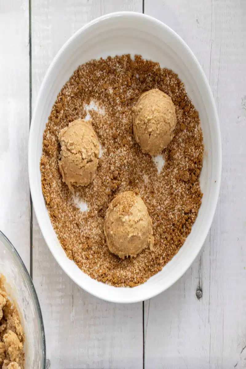 rolling cookie dough in cinnamon sugar
