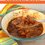 chicen stew in a pot with spoon and text overlay